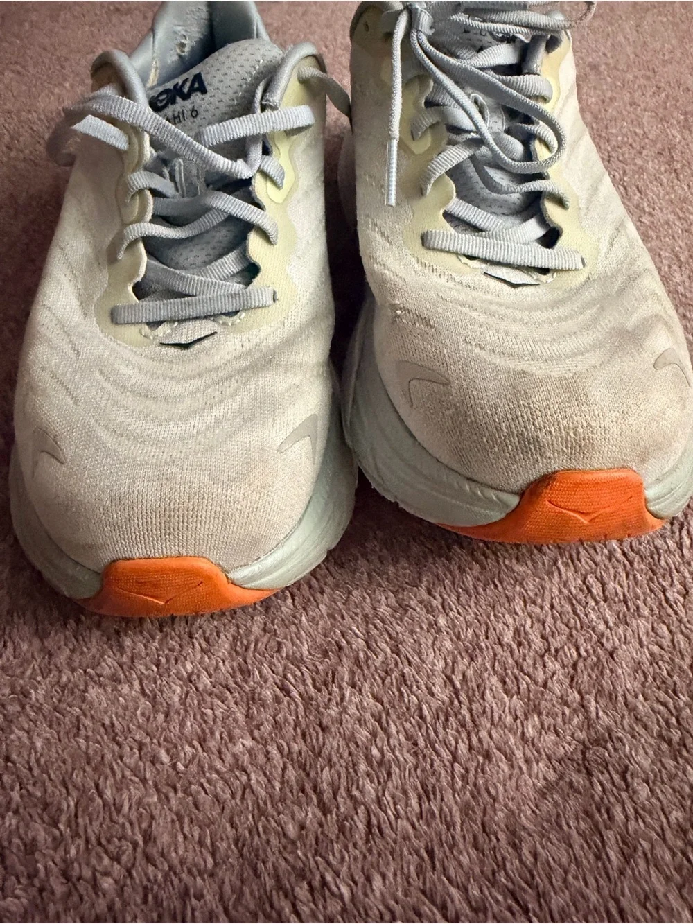 Hoka light gray and yellow running shoes